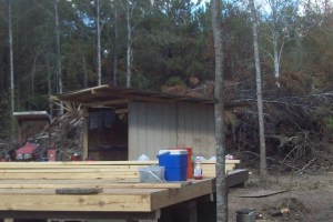 lean-to, beginning flooring and burn pile